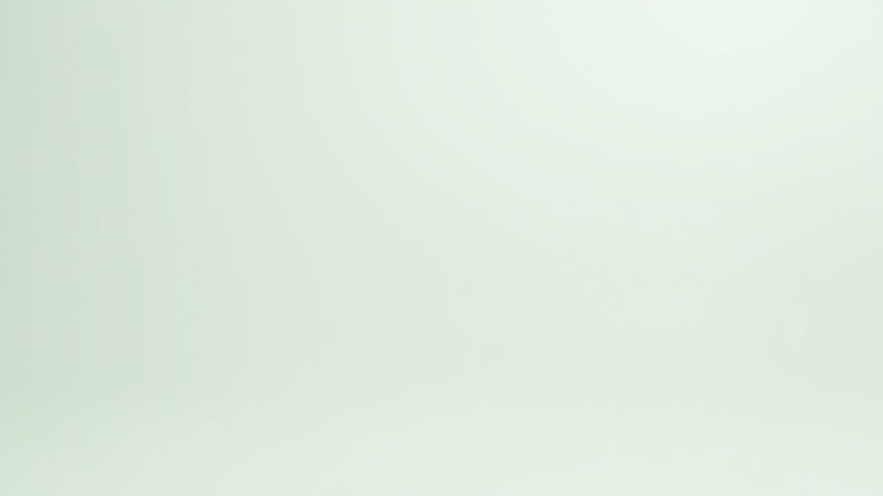 A collection of neatly arranged eco-friendly cleaning products in reusable bottles with plant-based labels, alongside microfiber cloths and a pure water system hose.